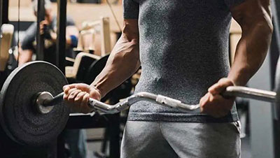 The difference between straight bar barbell and W bar barbell